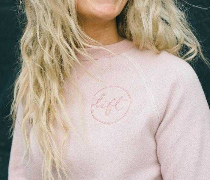 ottawa embroidery custom sweatshirt with logo woman blonde smiling
